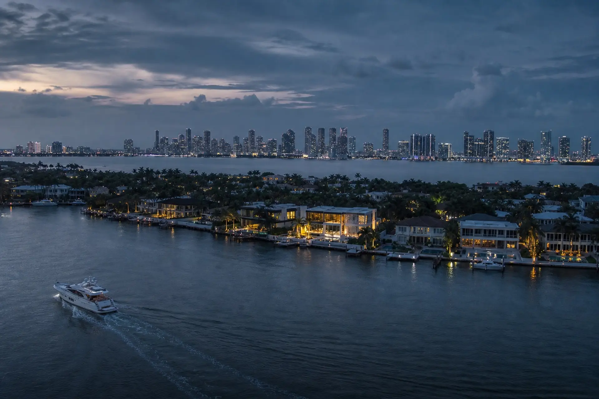 Waterfront homes and the city skyline at dusk